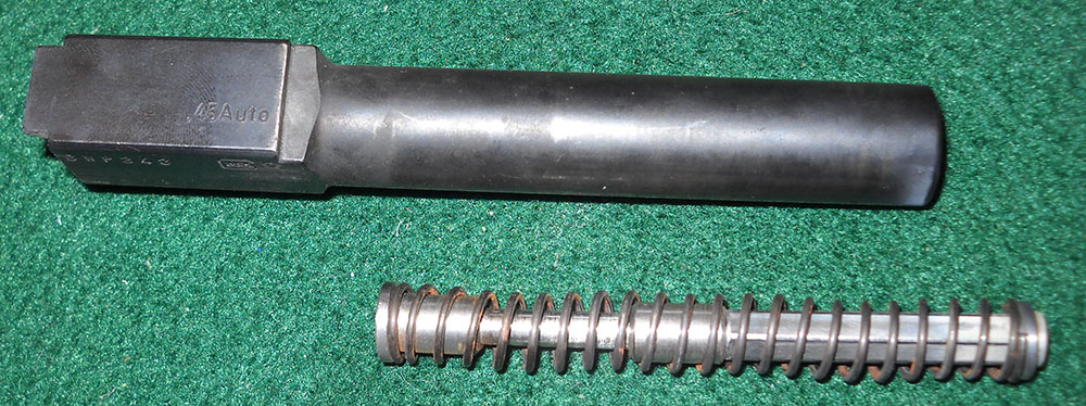 detail, Glock 21 barrel, top view, plus recoil spring